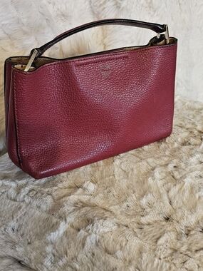 MCM Burgundy Pebbled Leather Top-Handle Clutch Styled With Unbranded Chain.